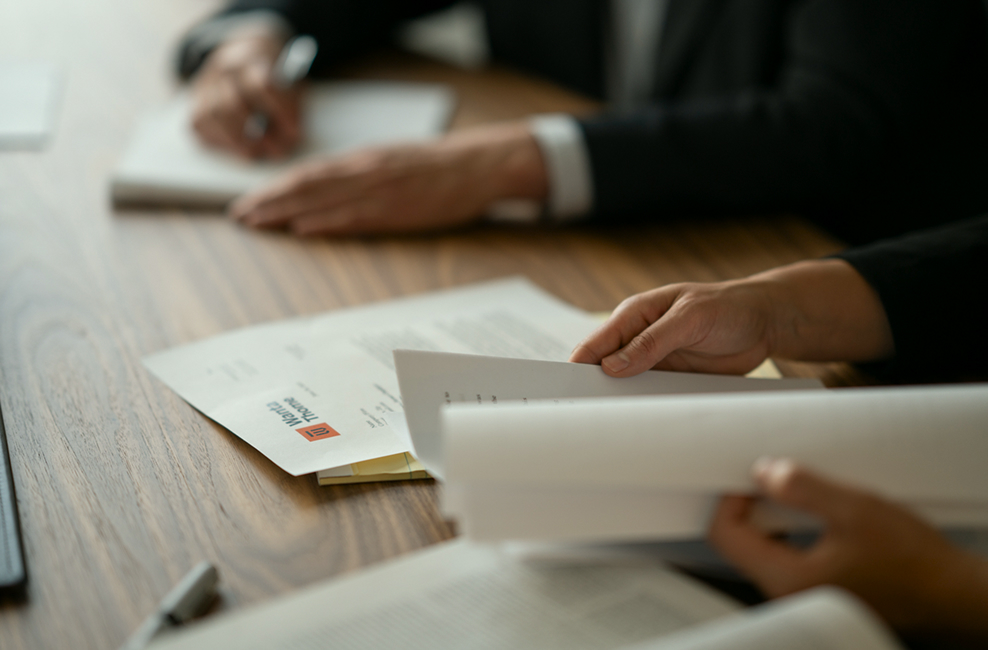 Attorney hands reviewing documents on a table