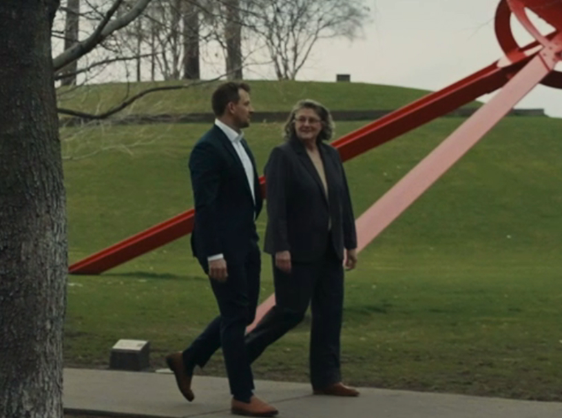 Two Wanta Thome team members walking together outdoors